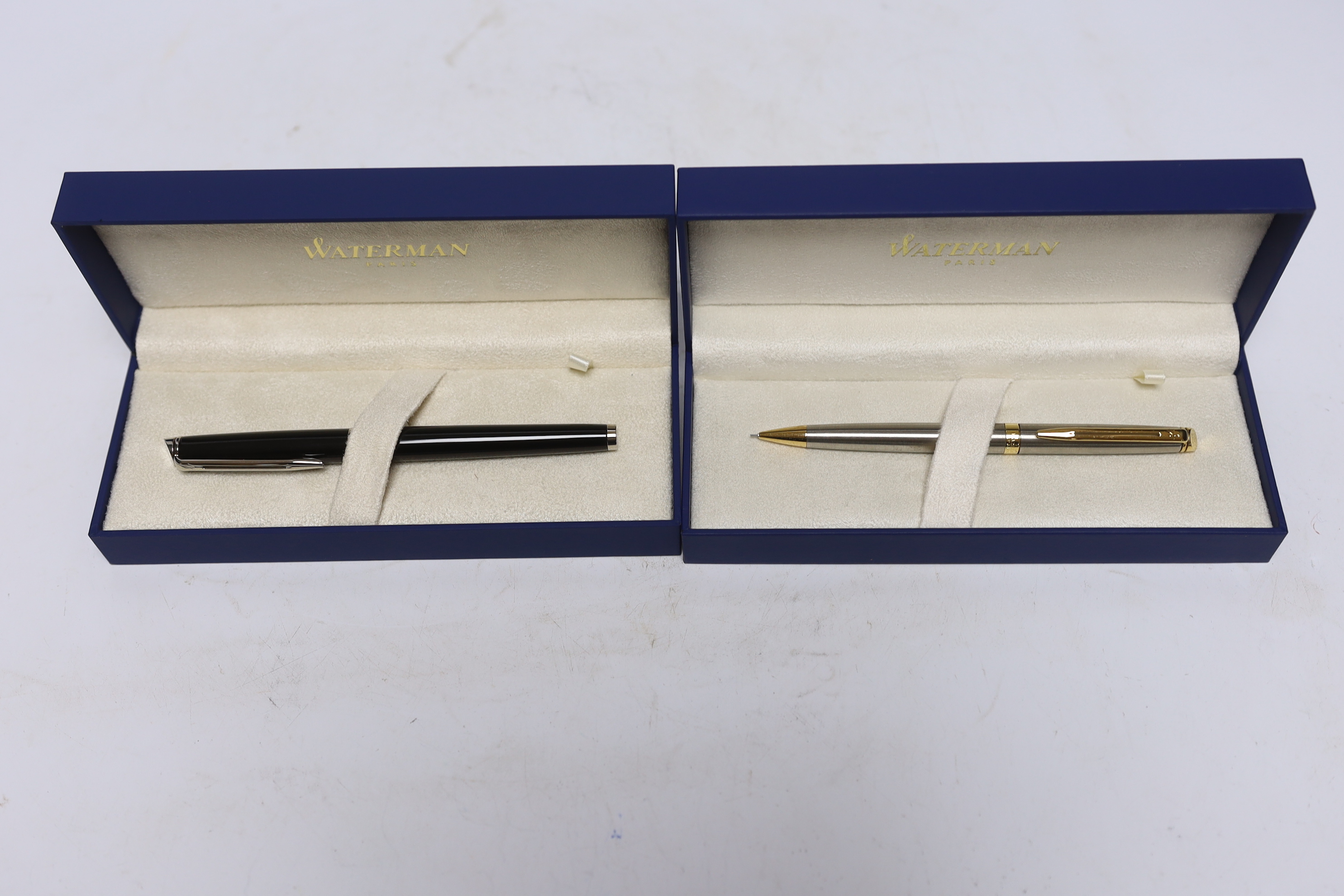 Four Waterman writing implements, including three propelling pencils; two Hemisphere pencils and an Expert pencil, and an Hemisphere fountain pen